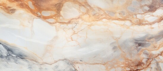 A close up of a beige marble texture resembling a painting. The natural material has a peach and wood pattern, creating a flooring that mimics the beauty of a rock or fur