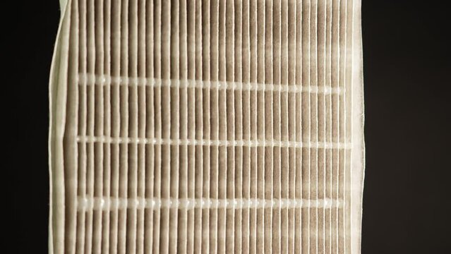 Replaceable HEPA air filter macro close up. Filter for air purification from fine dust and odours and other allergen air pollution. Helps breathing better by trapping pollutants in the air.