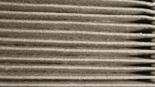Air filter surface pattern macro close up, used for maintenance of hygiene and pure air to prevent dust allergies and seasonal pollen allergens. Filter for central ventilation system furnace.
