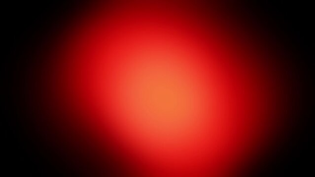 Blurred red glow on a black background. Stock video with abstract fire in full HD.