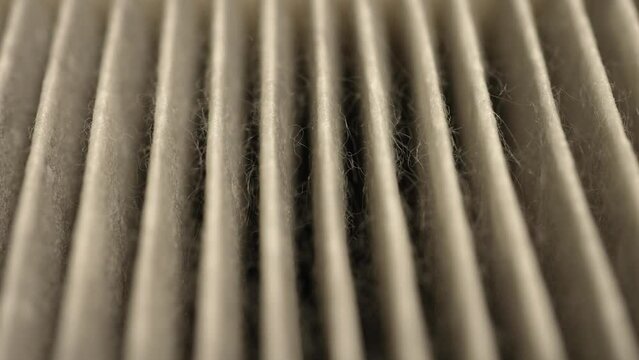 Air filter surface pattern macro close up, used for maintenance of hygiene and pure air to prevent dust allergies and seasonal pollen allergens. Filter for central ventilation system furnace.