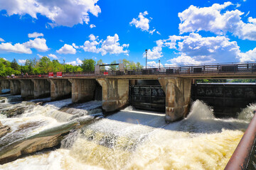 Roaring rapids of the Hogs back waterfall are formed from the dam on the Rideau river at the...