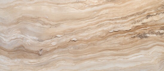 A close up of a marble texture with a swirling pattern resembling brown wood stain on beige...