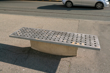 modern bench in an urban university and exhibition space, urban furniture with a modern design worn...