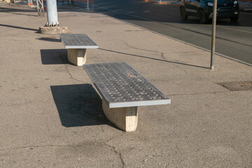 modern bench in an urban university and exhibition space, urban furniture with a modern design worn...
