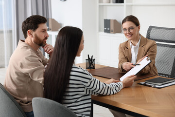 Couple having meeting with lawyer in office