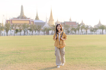 A Traveler Asian woman in her 30s exploring Wat Pra Kaew. From stunning architecture to friendly locals, she cherishes every moment, capturing it all in her heart and camera for years to come.