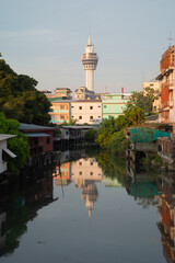 Samut Prakan Observation Tower with river reflection in urban city town, Thailand.