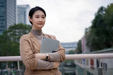 Confident Young Professional with Tablet in Urban Setting