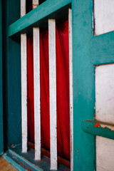 iron on old windows with red curtains