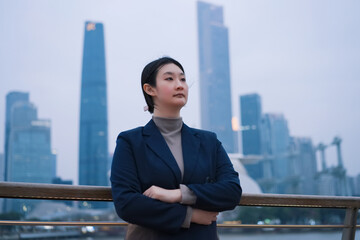 Confident Businesswoman with Urban Backdrop