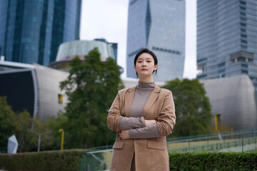 Confident Businesswoman Standing in Urban Landscape