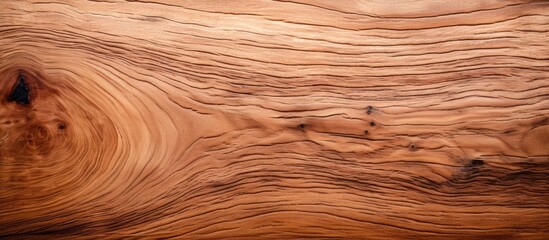 A closeup of a brown hardwood plank showcasing the intricate grain pattern and texture, perfect for flooring or furniture. Can be enhanced with wood stain or varnish