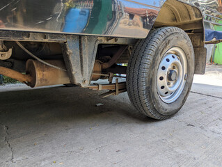 a rim and tire on the rear of the car.