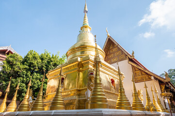 Golden pagoda at the back of viharn in Wat Phra Singh temple in Chiang Rai province of Thailand.