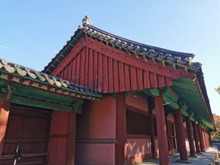 Traditional Korean Hanok Village buildings red brown doors in afternoon in Seoul, South Korea