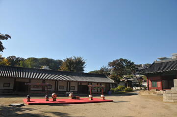 SEOUL, SOUTH KOREA - OCTOBER 24, 2022: Korean traditional musical instruments and main ground of Sungkyunkwan University in Autumn with foliage trees