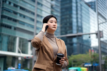 Confident Businesswoman Walking Through City Streets