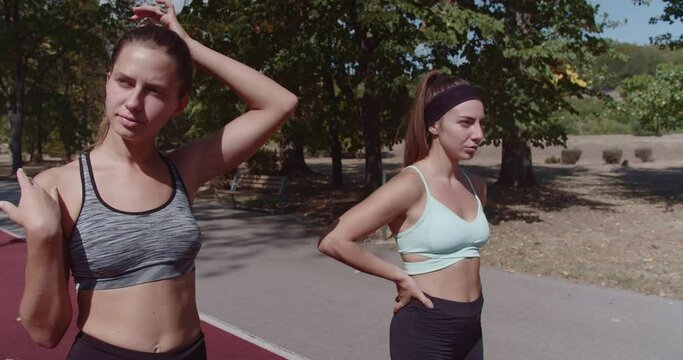 An image capturing the essence of friendship and fitness with three women preparing for running in a urban park at the city.