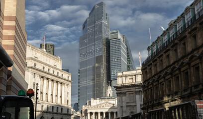 Fototapeta na wymiar View of Bank of England, Royal Exchange with skyscrapers in background of the City of London. Space for text, Selective focus.