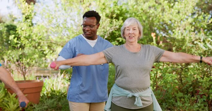 Elderly care, weightlifting for exercise and physio, old people and caregiver in garden with rehabilitation and healing. Happy, trust and muscle training for physical therapy outdoor at nursing home