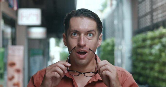 Man glasses unexpectedly achieves win, spontaneous moment success. surprise joy, unpredictability thrill success. significance victories, reaction sudden achievement, success accomplishment happiness.