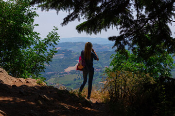 Girl photographer take pictures of a mountain