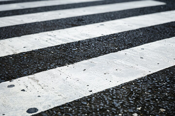 Fototapeta premium a crosswalk with a white stripe on the street