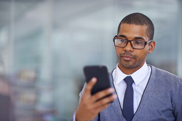 Business man, phone and texting in office for networking, contact and reading for email notification. African person, smartphone and check with mobile app, mockup space and connection in workplace