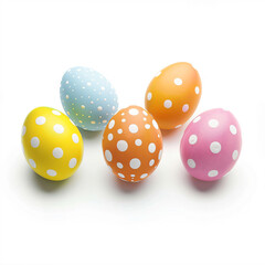 a group of four colorful polka dot eggs