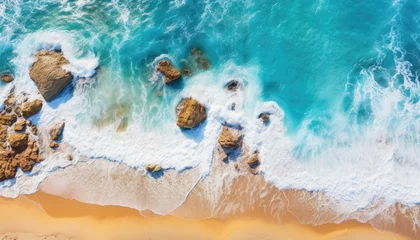 Ingelijste posters Aerial view of a paradise beach where the sea waves break on the shore. Top view of a beautiful sandy coast with turquoise blue water and white foam on sunny day. Summertime, traveling, vacation. © cabado