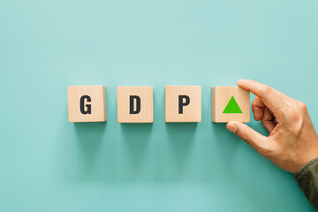 GDP percent change, Increasing GDP. Hand putting wooden block with arrow up sign for interest rate ,ranking and financial stocks