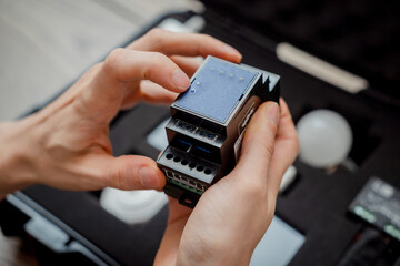 A technician works with a demo kit of the smart home system