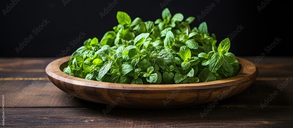 Wall mural Fresh Green Mint Leaves Piled High in a Rustic Wooden Bowl for Aromatic Culinary Delights