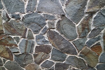 Texture of a stone wall. Old castle stone wall texture background. Stone wall as a background or...