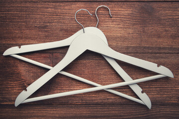 Grey hangers on brown wooden table