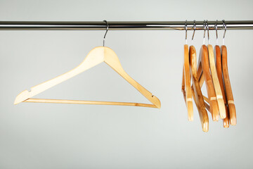 Wooden clothes hangers on grey background - 760324583