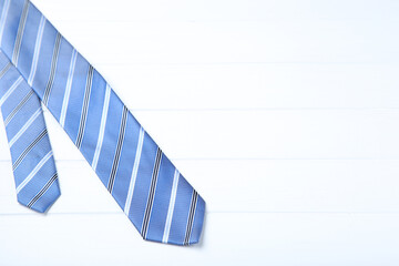 Striped necktie on white wooden table - 760324722
