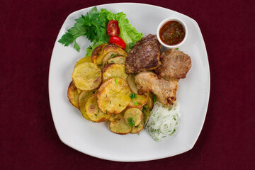 Meat steak with side dish on a white plate, restaurant menu