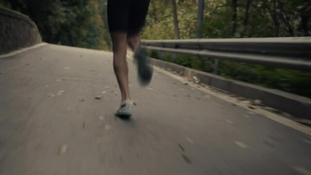 Man in sportswear jogging exercising and sprinting as part of triathlon	