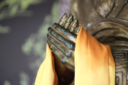 the jointec hands of a Buddhist