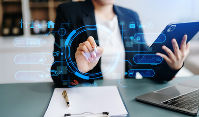 Businesswoman working virtual tablet computer twith reduce CO2 concept with icons, global warming such as reforest green factory