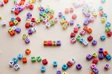Colorful cubes with the word RISK. A variety of risk concept