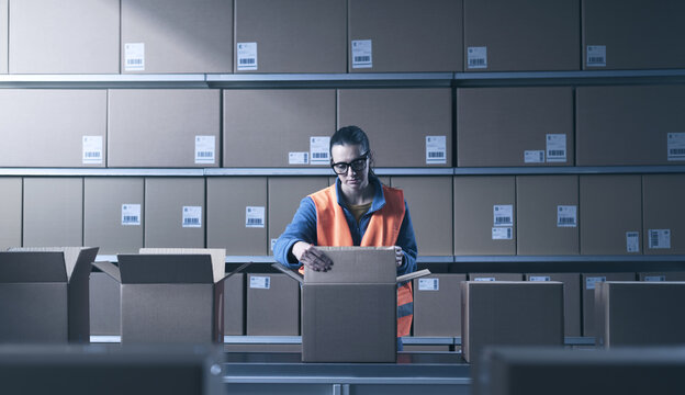 Bored woman working at the warehouse