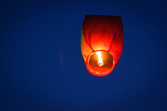 Chinese sky lanterns rising into the night sky