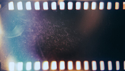 Abstract film texture background with grain, dust and light leaks; artistic image of the camera