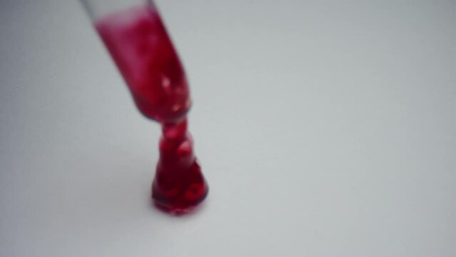 Close-up of a drop of blood with a pipette in the laboratory