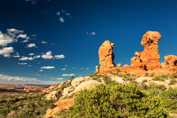 Arches National Park near Moab, Utah, USA, boasts stunning red rock formations, iconic arches,...