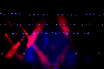 Stage light with colored spotlights and smoke.