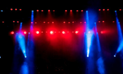 Stage light with colored spotlights and smoke.